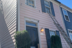 Finishing Painting the Exterior of Pink Town Home in Old Town Alexandria, VA
