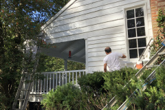 Team Working Together on Side of the Home in Fort Washington, MD
